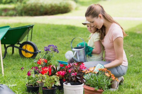 Gardening team measuring a garden for a free quote